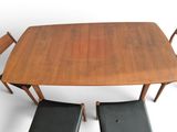 a wooden table with four chairs and a bench