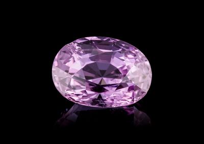 a purple diamond on a black background