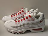 the nike air max 95 is a white, red and grey sneaker