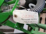 a close up of a green machine with a price tag on it