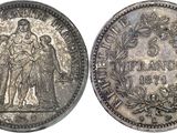 a close up of a silver coin with a woman on it