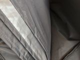 a close up of a bed with two pillows and a pillow case