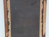 an old picture frame with a chalk board attached to it