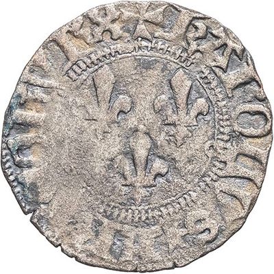 a silver coin with an image of a man on it