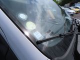 a close up of a car windshield with stickers on it