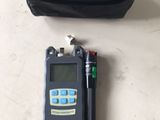 a black bag with a pen and a black bag with a black bag