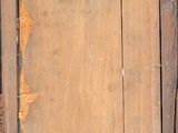 painting of an old wooden frame with a yellow label on it