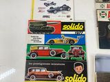 a lot of toy cars on display in a display case