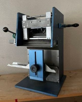 a machine that is sitting on top of a wooden table