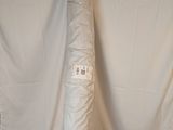 a large roll of white fabric on a white background
