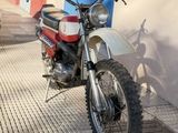 a motorcycle that is parked on the side of the street