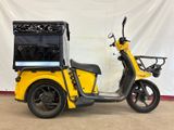 an image of a yellow motorcycle with a cart on the back of it