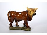 statue of a bull with a tag on it ' s neck