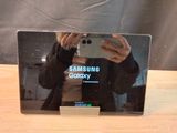 a man taking a picture of himself in the mirror