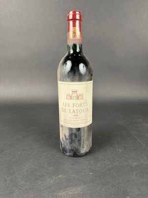 a bottle of wine that is sitting on a table