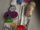 supplies laid out on a table including scissors, thread, scissors, and other items