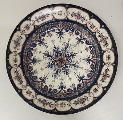 a plate with a blue and white design on it