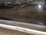 a reflection of a car in the window of a car