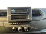 a radio in the center of a car with four knobs