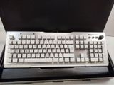 a computer keyboard sitting in a box on a table