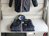 two pictures of a man ' s jacket and tie on display