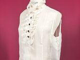 white top with lace trim and buttons on a mannequin dummy