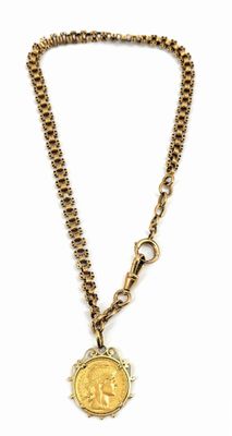 a close up of a necklace with a coin on a chain