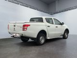 a picture of a white truck parked in a garage