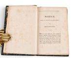 a book with a gold ring on top of it