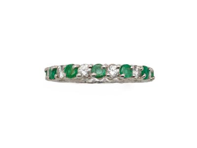 an emerald and diamond five stone ring