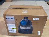 a box that has a blue and white machine inside of it