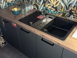 a kitchen with a sink and cabinets in it