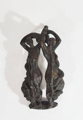pair of bronze figurines of two women holding baskets on their heads