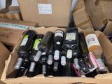 many bottles of wine sitting in a cardboard box