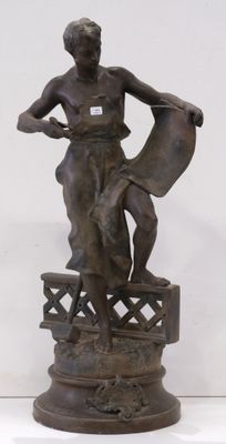 bronze statue of a woman with a basket on a pedestal