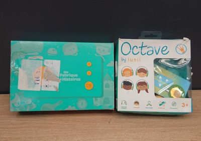 two boxes of baby diapers sitting on a table next to each other