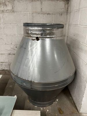 a large metal object in the corner of a room