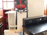 an image of a desk with a child ' s car seat on top of it