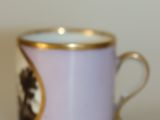 a purple cup with a picture of a cat on it