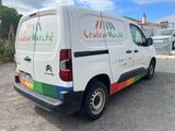 a white van that is parked in a parking lot