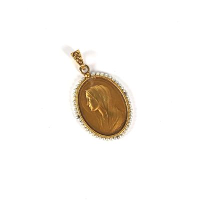 a close up of a gold coin with a woman ' s face on it