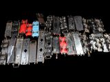 many pieces of metal that are sitting on a black surface