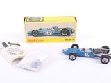 a small blue race car in front of a box