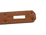 a close up of a brown leather belt with a metal buckle