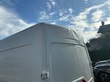 a white van that is parked in a parking lot