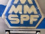 a sign that says mm spf on the side of a machine