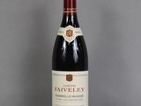 a bottle of wine that is sitting on a table
