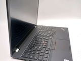 a laptop with a black keyboard on a white surface