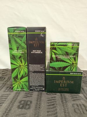 three boxes of imperial estt on a bed next to each other