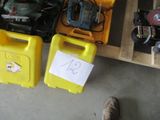 two yellow boxes with tools and a person standing next to them